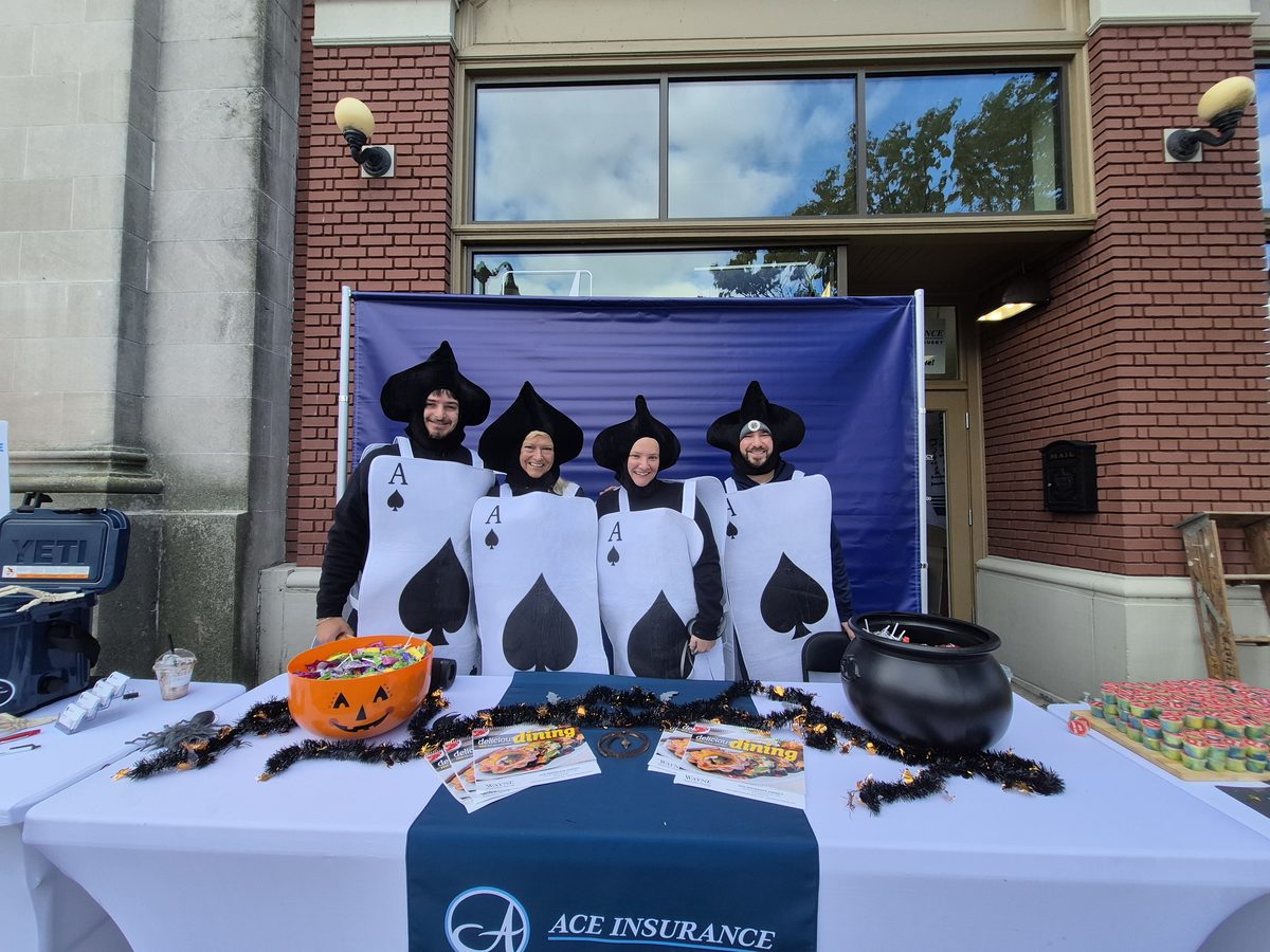Ace Insurance team in costume at a community event