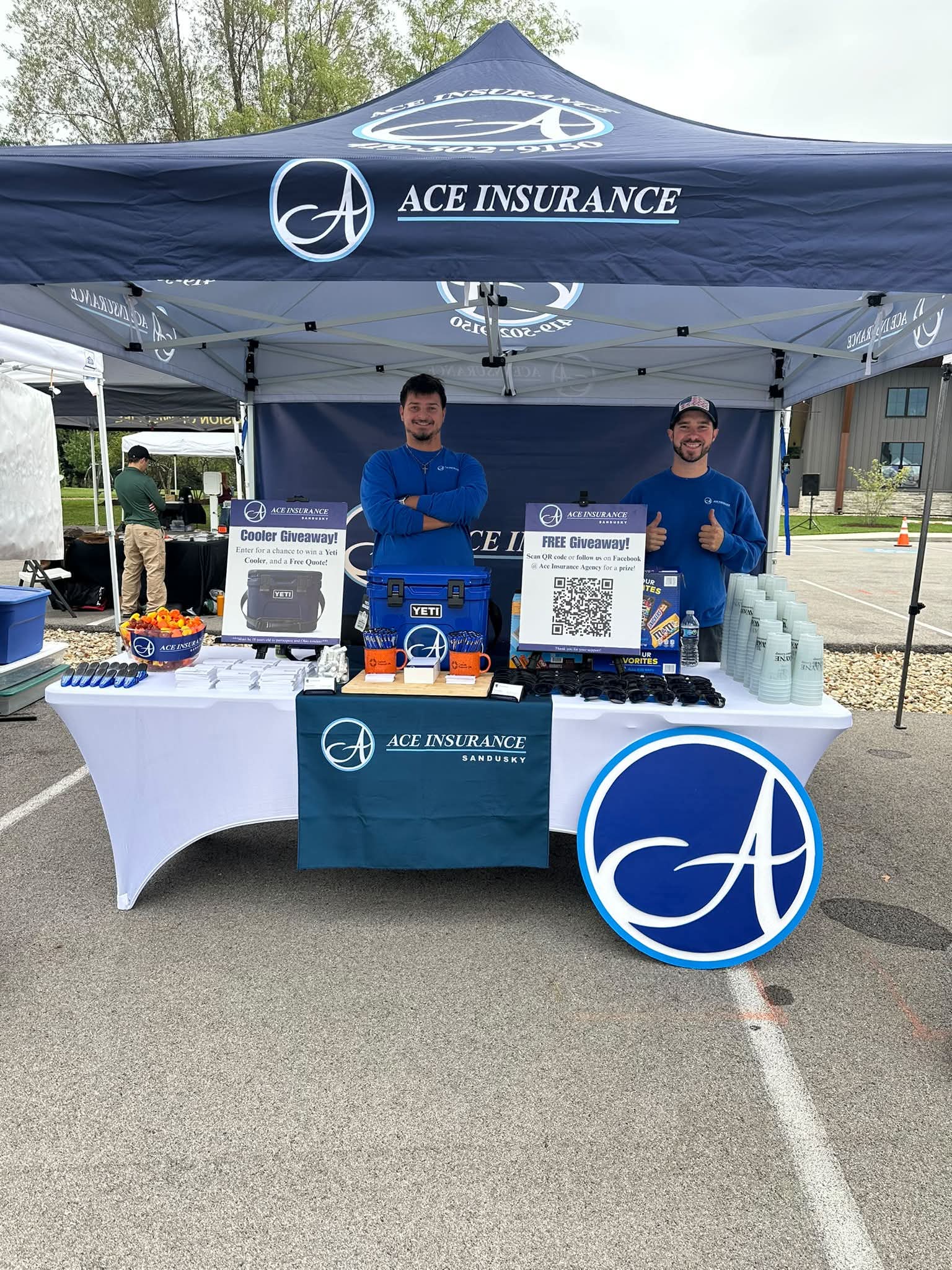 William Perry and Luke Schaefer at the Ace Insurance tent at a community event